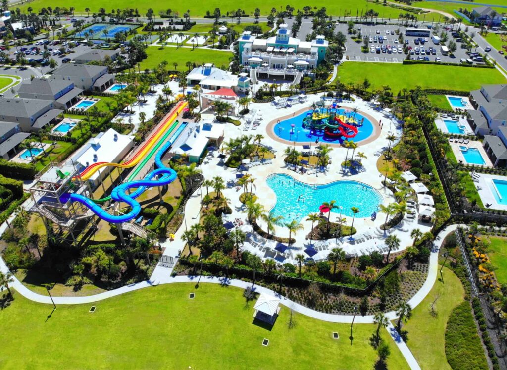Encore Resort at Reunion bird’s eye view of water park, clubhouse, and surrounding vacation homes
