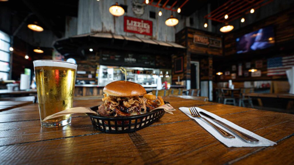 Lizzie’s Memphis Style BBQ sandwich with a bear on a table in the dining room