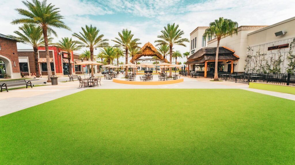 Promenade Plaza at Sunset Walk with outdoor stage and restaurant seating areas