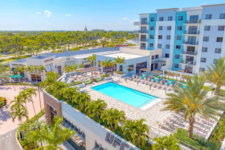 The Rise at Plantation Walk apartments with rooftop pool overlooking a shopping plaza