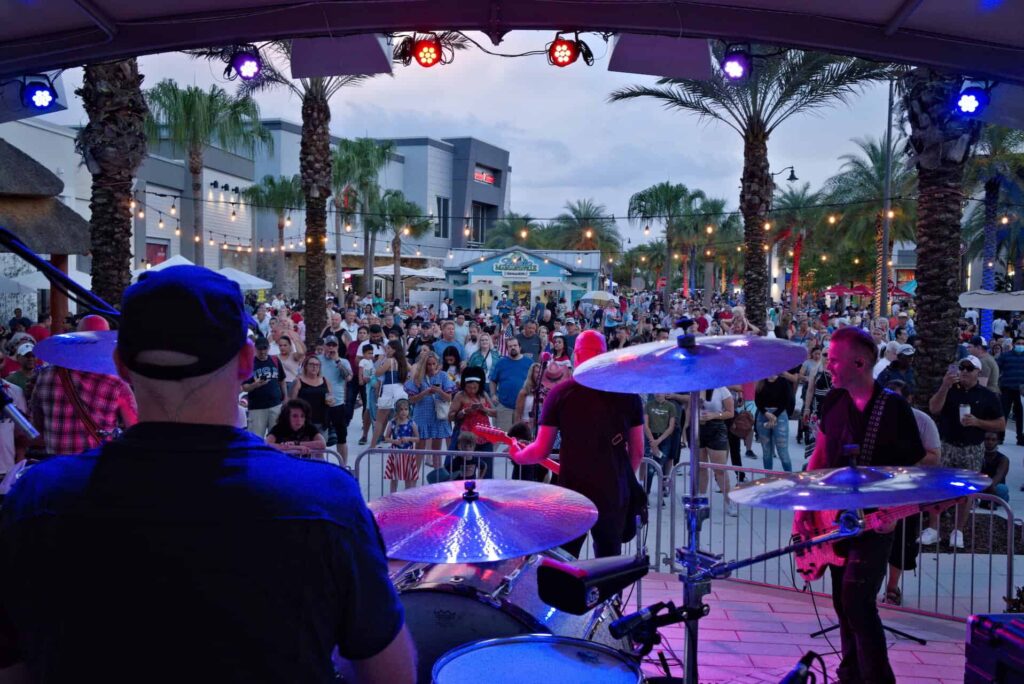 Live band playing on stage at the Promenade at Sunset Walk